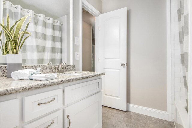 bathroom with vanity, tile patterned floors, and shower / bath combo