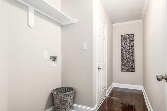 laundry area with ornamental molding, dark hardwood / wood-style floors, and washer hookup