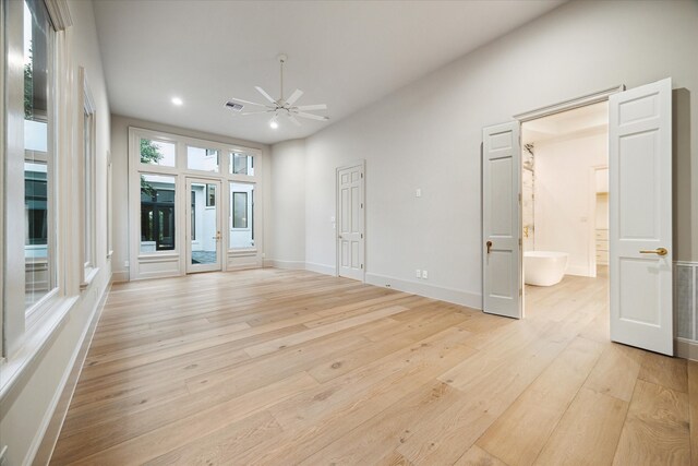 empty room featuring ceiling fan and light wood-type flooring