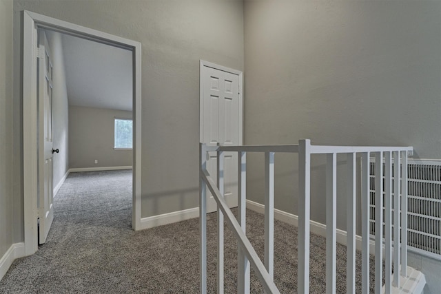 corridor with carpet floors