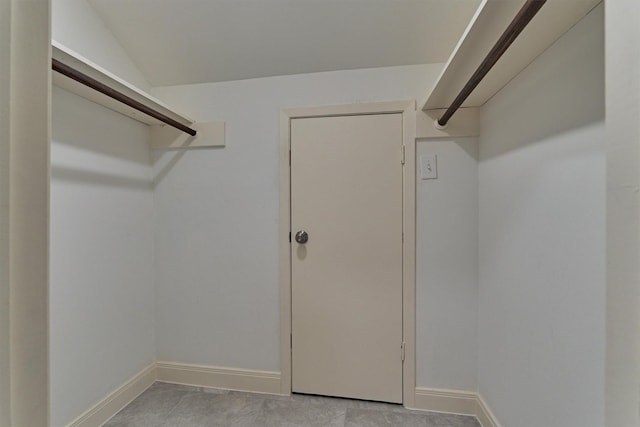 spacious closet featuring lofted ceiling