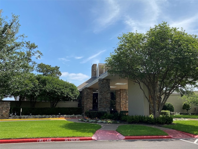 view of front of property with a front lawn