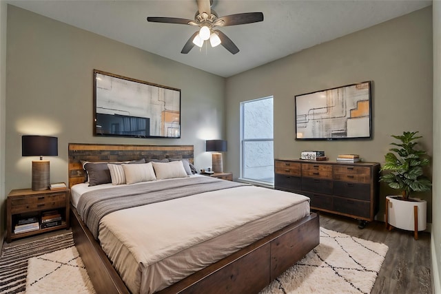 bedroom with ceiling fan and dark wood-type flooring