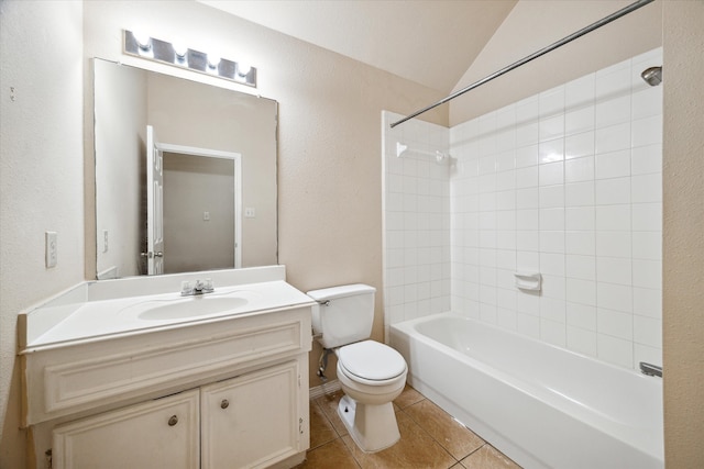 full bathroom with vanity, tile patterned flooring, toilet, lofted ceiling, and tiled shower / bath combo