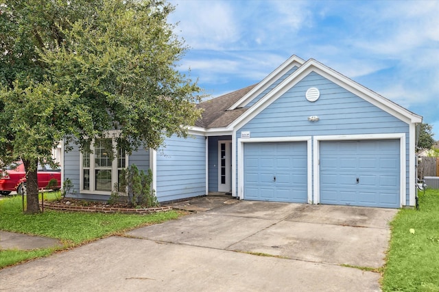 view of front facade featuring a garage and a front lawn