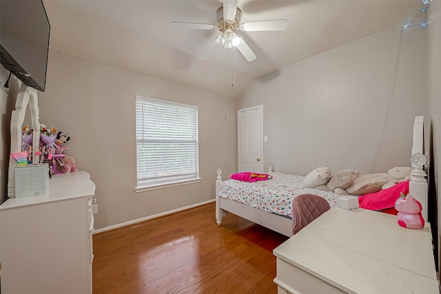 bedroom featuring vaulted ceiling, light wood-type flooring, and ceiling fan