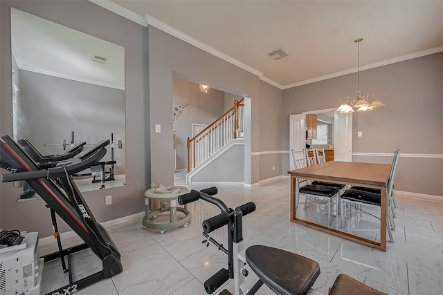 exercise room with a notable chandelier and ornamental molding