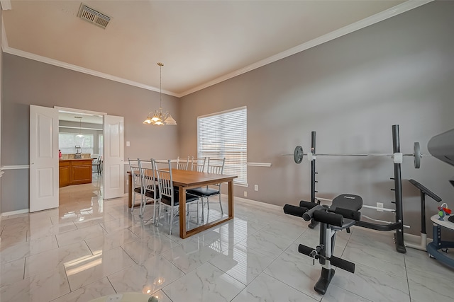 dining area with crown molding and an inviting chandelier