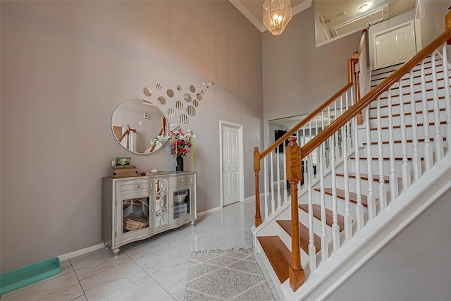 entrance foyer featuring a towering ceiling