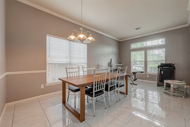 dining room featuring ornamental molding and a chandelier