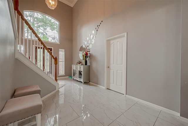 entrance foyer featuring a towering ceiling