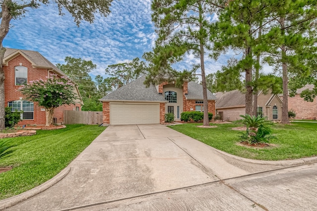 view of front facade featuring a front yard and a garage