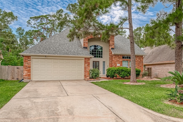 view of front facade with a garage and a front lawn