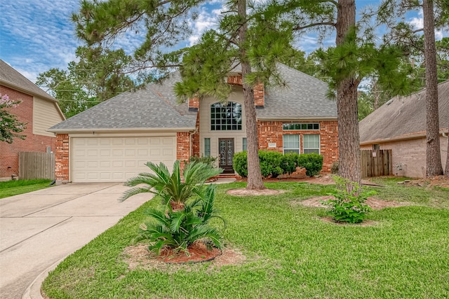 view of front of house featuring a front lawn and a garage