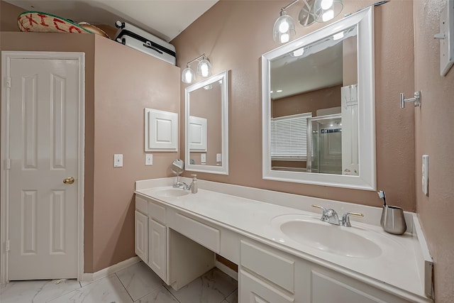 bathroom featuring vanity and a shower with shower door