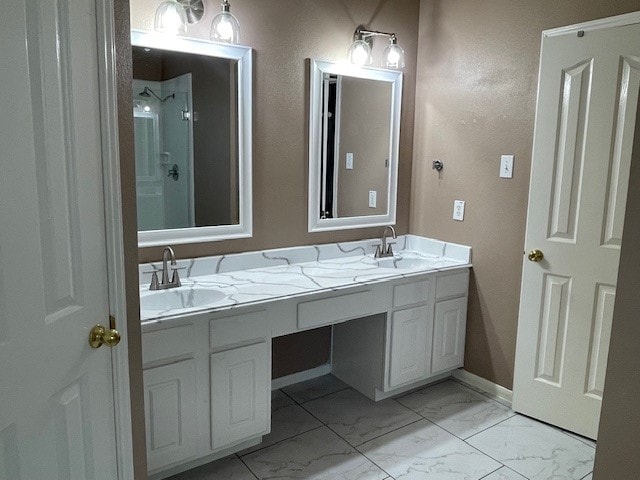 bathroom with vanity and walk in shower