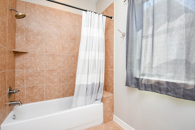 bathroom featuring shower / tub combo with curtain