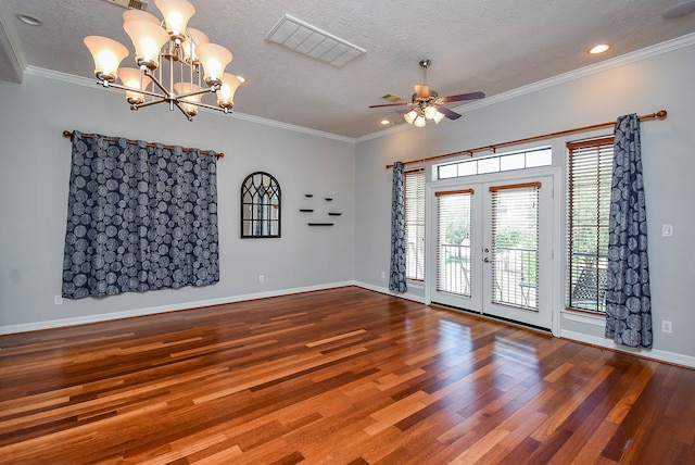 empty room with ceiling fan with notable chandelier, a textured ceiling, ornamental molding, and hardwood / wood-style floors