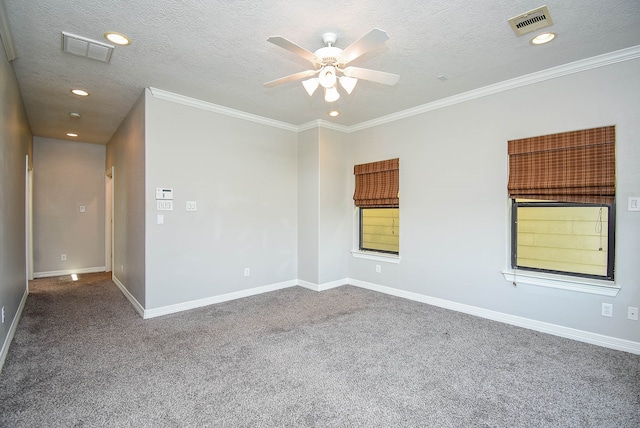 carpeted empty room with ceiling fan, crown molding, and a textured ceiling