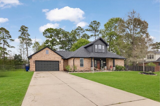 view of front of home featuring a garage and a front lawn