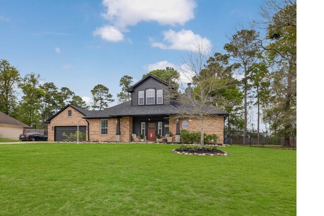 view of front of property featuring a garage and a front lawn