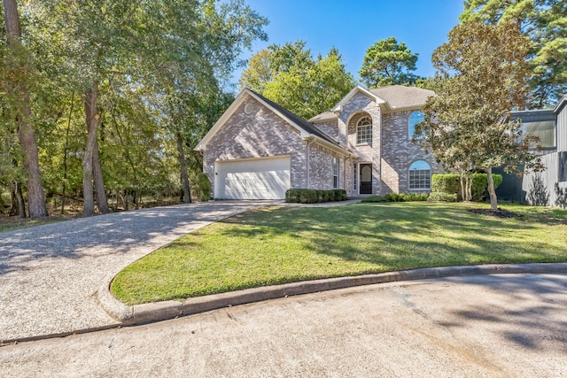 view of front property featuring a garage and a front lawn