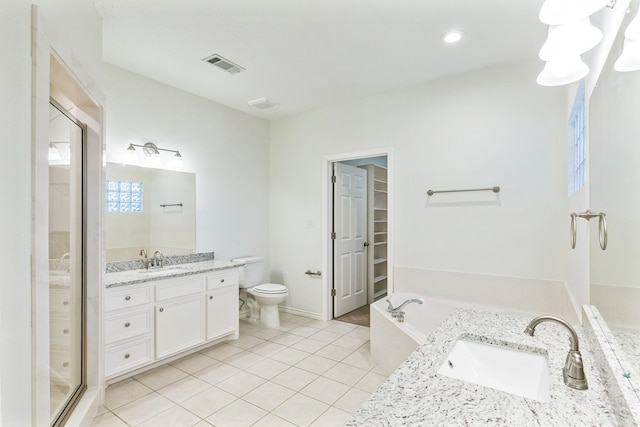 full bathroom featuring a healthy amount of sunlight, vanity, tile patterned floors, toilet, and separate shower and tub