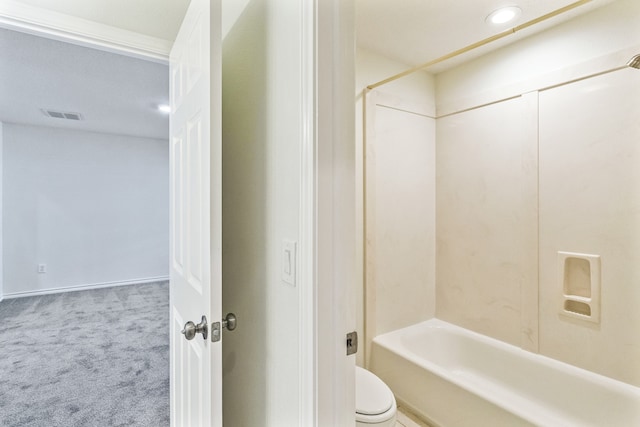 bathroom featuring bathing tub / shower combination and toilet