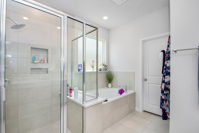 bathroom featuring tile patterned floors and plus walk in shower