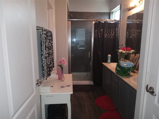 bathroom with vanity, walk in shower, and tile patterned floors