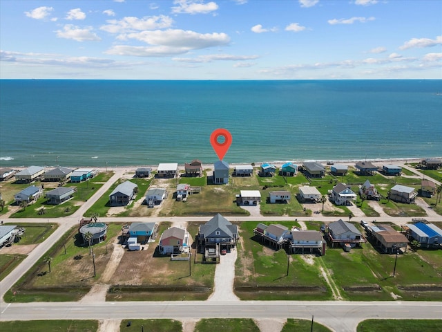 birds eye view of property featuring a water view and a residential view