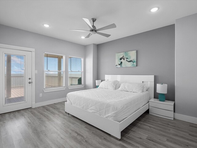 bedroom with wood finished floors, access to exterior, baseboards, ceiling fan, and recessed lighting