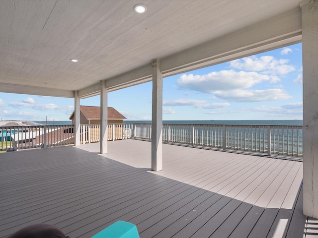 wooden terrace with a water view