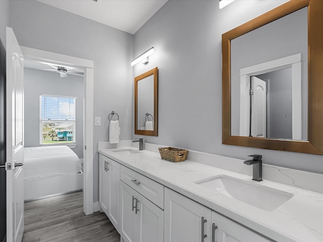 bathroom featuring ceiling fan, hardwood / wood-style flooring, and vanity