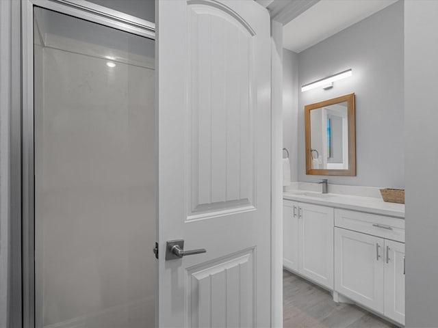 bathroom featuring vanity and wood finished floors