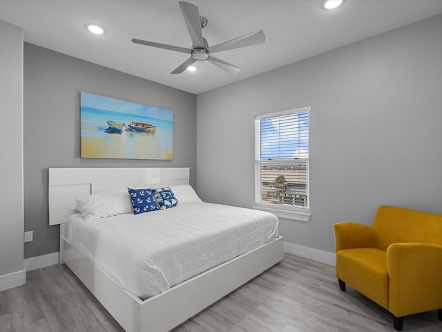bedroom featuring baseboards, recessed lighting, and wood finished floors