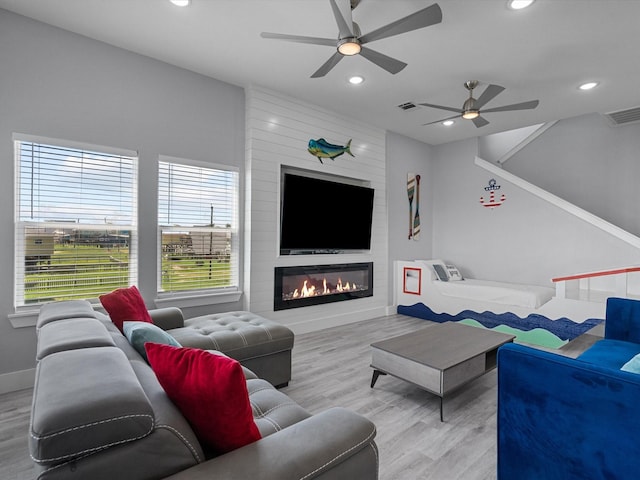 living room featuring visible vents, wood finished floors, a ceiling fan, and recessed lighting