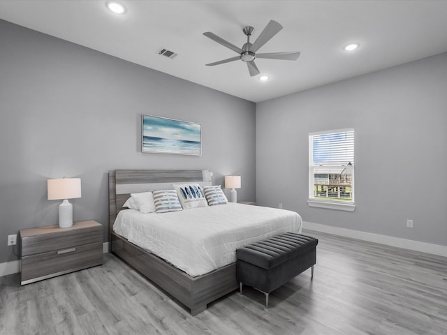 bedroom featuring wood finished floors, visible vents, recessed lighting, a ceiling fan, and baseboards