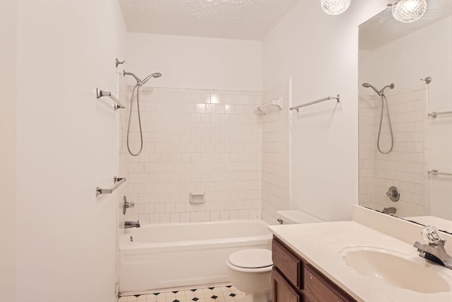 full bathroom with toilet, tile patterned flooring, tiled shower / bath, vanity, and a textured ceiling