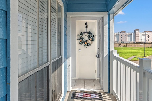 entrance to property featuring a balcony