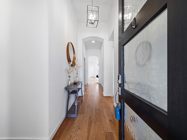 hallway with hardwood / wood-style floors