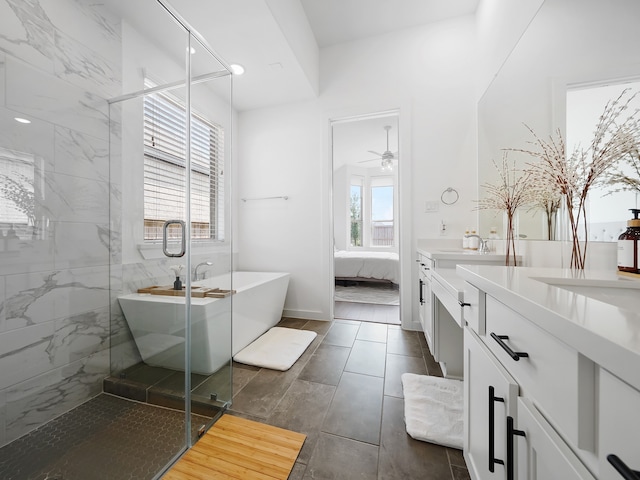 bathroom with a wealth of natural light, vanity, ceiling fan, and shower with separate bathtub