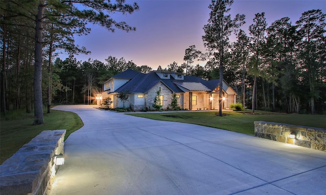 view of front of property with a lawn