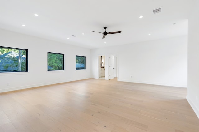 spare room featuring ceiling fan and light wood-type flooring