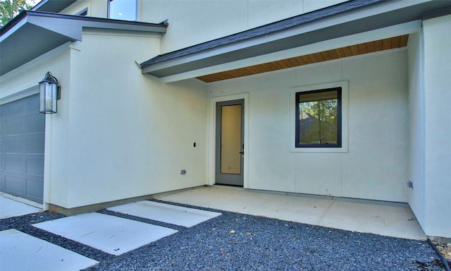 entrance to property featuring a garage