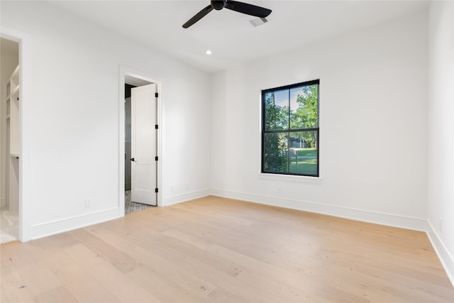 spare room with ceiling fan and light hardwood / wood-style floors