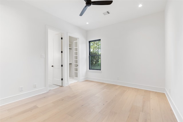 unfurnished room featuring ceiling fan and light hardwood / wood-style floors