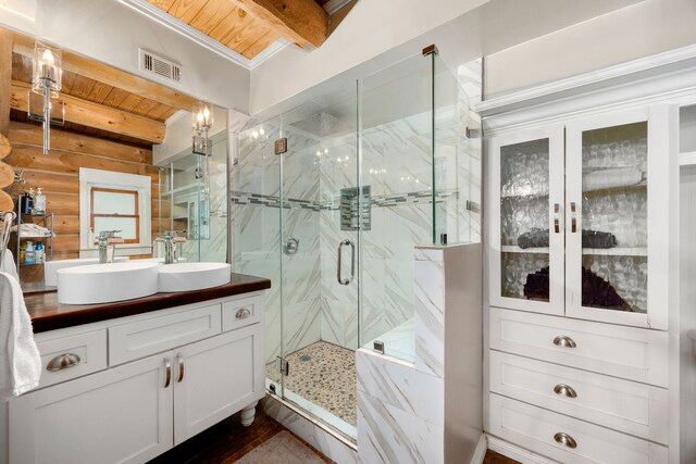 bathroom featuring beam ceiling, vanity, wood ceiling, and a shower with shower door