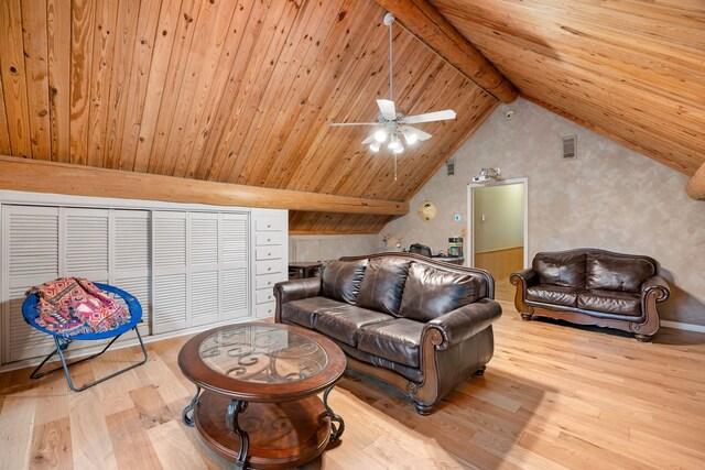 living room featuring wood ceiling, ceiling fan, beamed ceiling, and light hardwood / wood-style floors