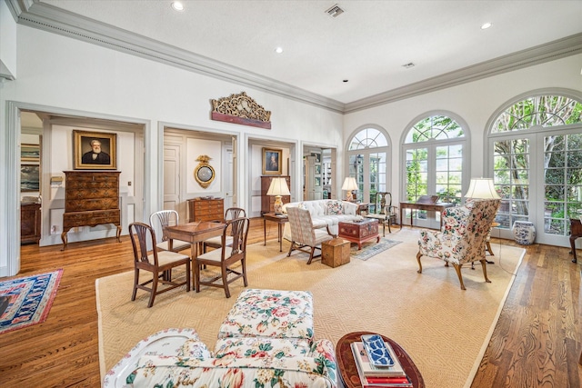 2509 Westgate Dr, Houston, TX 77019 - living room featuring crown molding, a high ceiling, light wood-style flooring, and recessed lighting